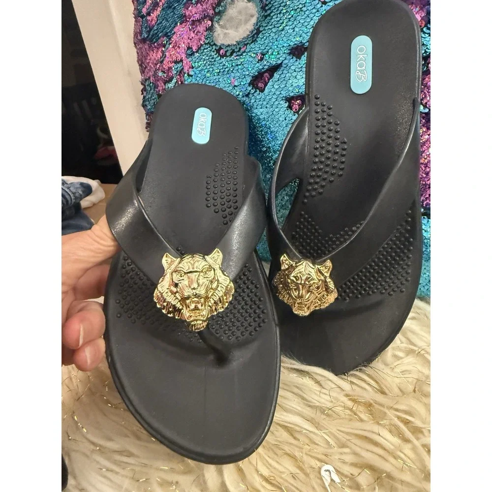 New Okab Black Licorice Gold Lion Head Rubber Flip Flop Thong Sandals Womens M/L